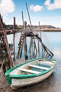 Boat aground and a pier photo