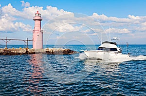 Boat by Algoma Pierhead Lighthouse photo