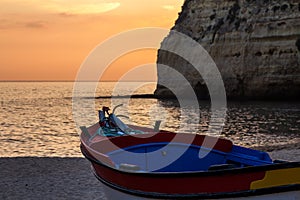 Boat along the coast at sunset