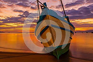 Boat anchored on the beach
