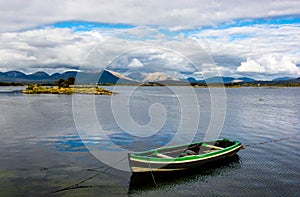 Boat Anchored In The Harbor Of Roundstone In Ireland