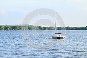 Boat anchored on lake