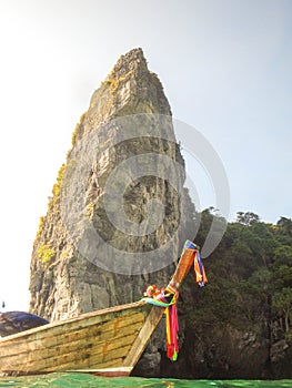 Boat in Ao nang bay, Thailand. High cliff, great rock