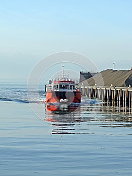 Boat Approaching Harbour
