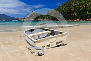 Boat on beach Aventueiro of island Ilha Grande, Br photo