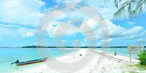 Boat on the beach with blue landscape background