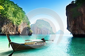 Boat on small island in Thailand photo