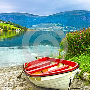 Boat on the beach, Norway fjords. Norwegian village Olden