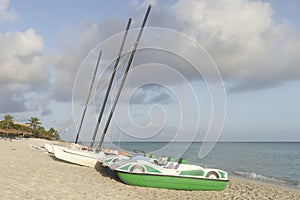 Boat on the beach, season of rains, thunderclouds