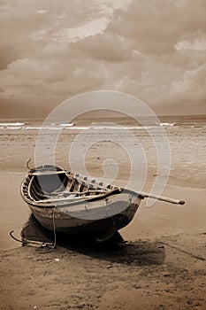 Boat on a beach in sepia