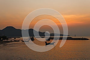 Boat on the beach at sunrise time