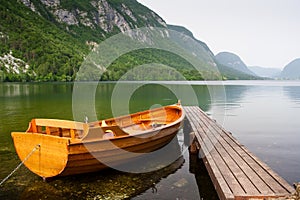 boat berth by the tranquil lake pier with mountain