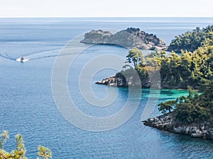 Boat on the blue of Aegean sea of Greece summer travel destination