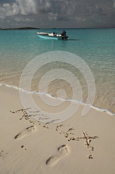 Boat in blue tropical ocean beach