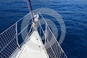 Boat bow sailing in blue Mediterranean sea