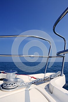 Boat bow sailing sea with anchor chain winch