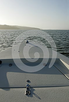 Boat bow toward bay mouth