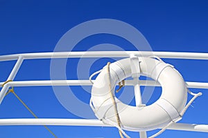 Boat buoy white hanged in railing summer blue sky