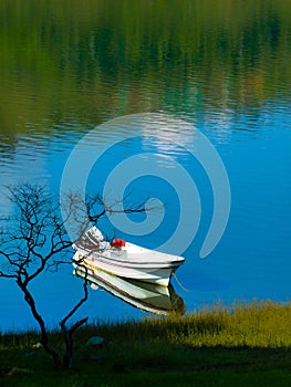 Boat on calima lake, colombia photo