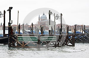 Boat called Gondolas and the text SERVIZIO GONDOLE that means GO photo