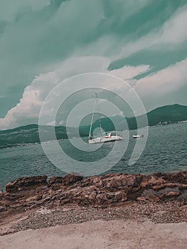 Boat on a calm sea on a cloudy da