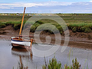 Boat on the calm water, Blakeney, North Norfolk coast, East Anglia