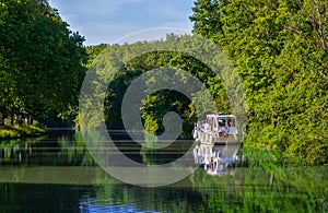 Boat on Canal du Midi, travel by barge and vacation in France