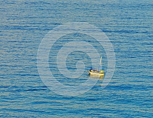 Boat in the Caribbean Sea, tropical ocean, top view. Beautiful sea in Mexico on a sunny day. Vacation Concept, Cancun