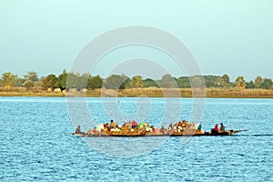 Boat carrying goods and people in Africa