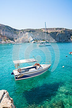 Boat on clear, turquois waters