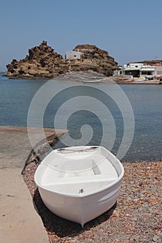 Boat on coast of sea bay. Cala Mesquida, Menorca, Spain