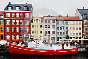 Boat and colourful old houses at Nyhavn harbour, Copenhagen