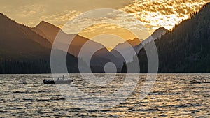 Boat comming in to the dock on Muchalat Lake on Vancouver Island, British Columbia, Canada