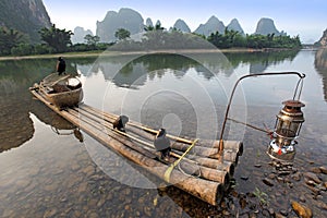 Boat with cormorants birds, traditional fishing in China use trained cormorants to fish, Yangshuo, China