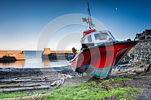 Boat in Craster Harbour photo