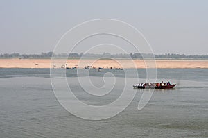 Boat Crossing the Ganges River in Varanasi, India