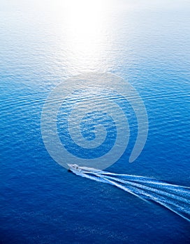 Boat cruising blue Mediterranean sea aerial view