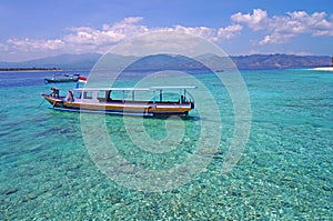 Boat on crystal clean turquoise water