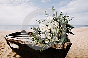 Boat decorated with flowers. Wedding day bouquet.