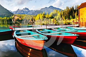 Boat on the dock surrounded mountains. Fantastic Shtrbske Pleso High Tatras. Slovakia