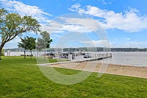 a boat dock with a view of the lake and forest,  in Lakeport New Hampshire.