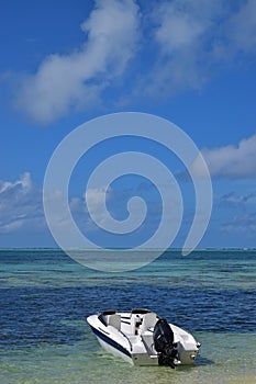 Boat docked on beach at Ile aux Cerfs Mauritius