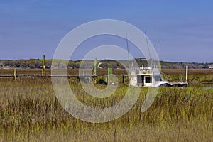 Boat docked in inlet waters near Charleston, South Carolina, USA photo