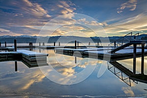 Boat docs in the winter sinrise and reflections