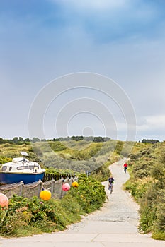 Boat in the dunes at a bicycle path in Borkum