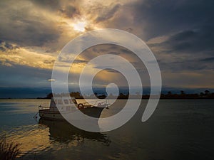 Boat in the Ebro Delta at sunrise, natural Park, Spain