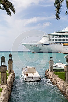 Boat Entering Channel Near Cruise Ship