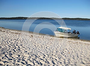 Boat on Estuary Foreshore photo