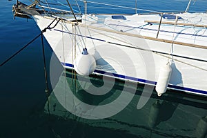 Boat Fenders on White Yacht photo