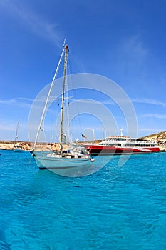 Boat and ferry at blue lagoon in Malta